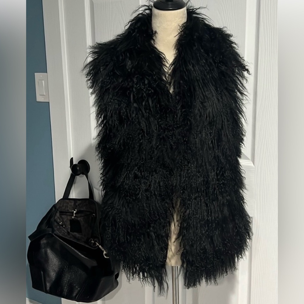Real fur vest, new condition. Smoke free home. Make an offer